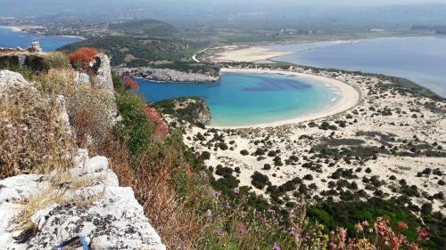 an aerial view of a beach on a cliff at Villa Finiki Messinia upstairs in Foiníki