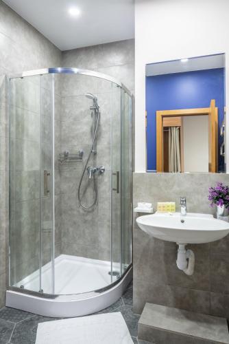 a bathroom with a shower and a sink at Comfort House in Kyiv