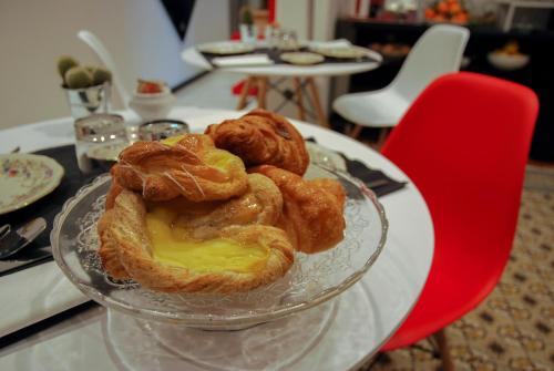 a glass plate with pastries on a glass table at Bb Tube in Genova