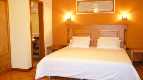 Postel nebo postele na pokoji v ubytování Villa Floreal Hotel Boutique