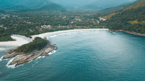 an aerial view of an island in the ocean at Laika Hostel in Camburi