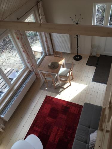 an overhead view of a living room with a table and chairs at Ferienhof Ohlenbusch in Worpswede