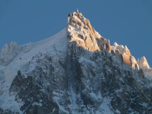 a tall mountain with snow on it at La Cubelette in Chamonix