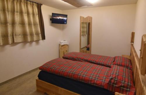 Ένα ή περισσότερα κρεβάτια σε δωμάτιο στο Chalet Li Mina