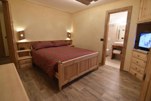 Ένα ή περισσότερα κρεβάτια σε δωμάτιο στο Chalet Li Mina