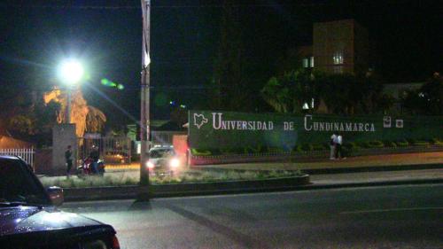 a truck driving down a street at night at Hotel Mónaco de Fusa in Fusagasuga