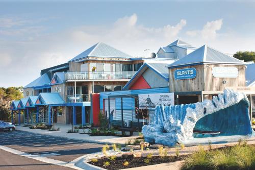 a building with a large iceberg in front of a street at The Island Accommodation in Phillip Island