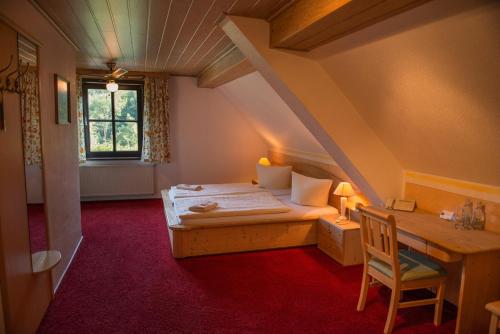A bed or beds in a room at Flair-Waldhotel Mellestollen