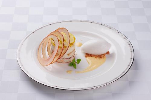 a plate with a sandwich and an egg on it at Hotel Marroad Karuizawa in Karuizawa