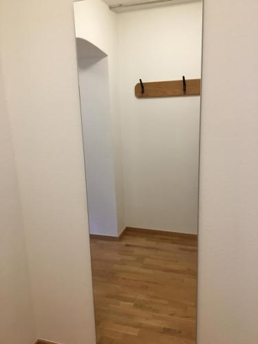 an open door to a room with a wooden cross on the wall at Hotel im Sonnental in Jachenau