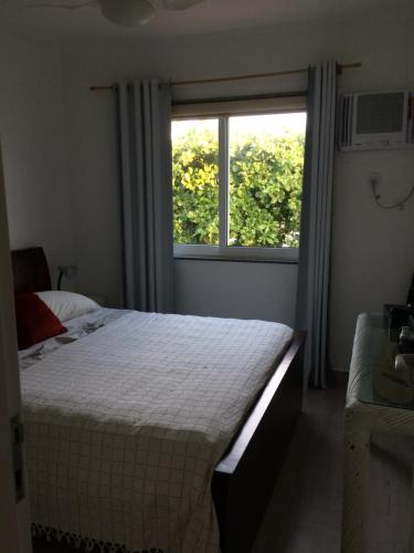 Cama o camas de una habitación en Casa na Praia Barra da Tijuca