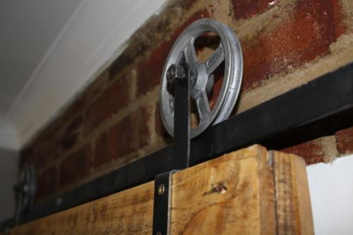 a metal ring on top of a brick wall at The Hancock Inn in Klerksdorp