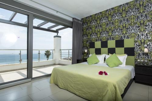 a bedroom with a bed with a view of the ocean at Ionian Pearl Luxury Spa Villa in Mesongi
