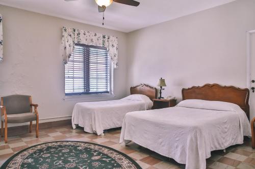 Ένα ή περισσότερα κρεβάτια σε δωμάτιο στο The Lodge at Wakulla Springs