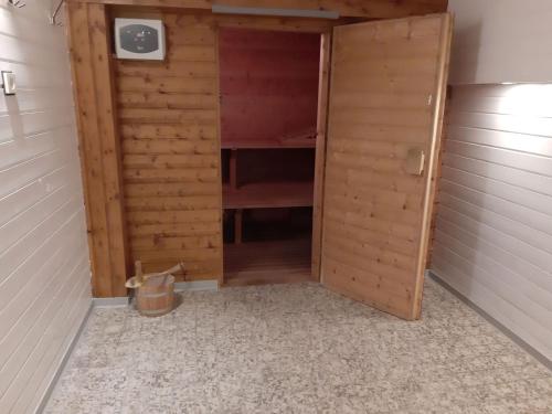 a closet with a door open in a room at Landhaus Schlossberg in Medebach