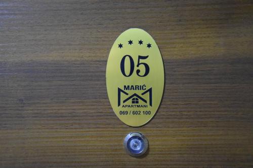 a yellow skateboard with the number on it at Apartmani Marić in Novi Pazar
