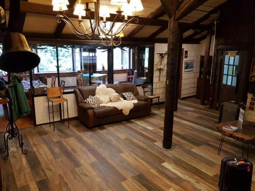 a living room with a couch and a table at The Patagonian Lodge in Coihaique
