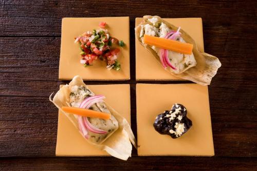 a group of food items on a wooden table at Hotel San Jorge in Tlatlauquitepec