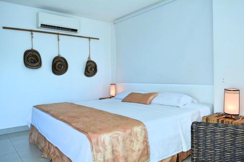 Torres del Lago Apartamentos tesisinde bir odada yatak veya yataklar