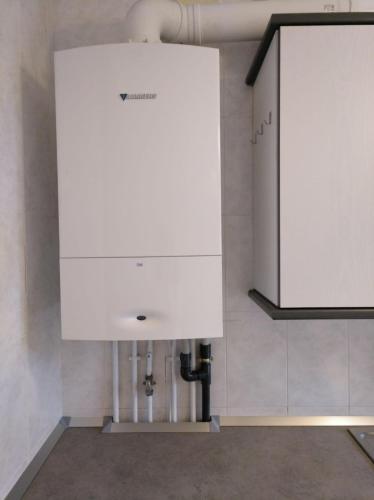 a kitchen with a white cabinet and a sink at Tena Biescas Tourist Home in Biescas