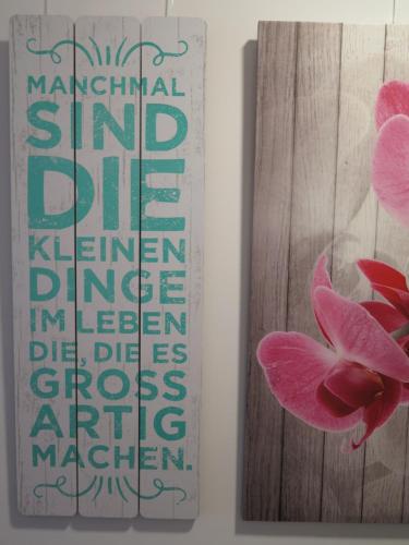 a picture of a pink flower next to a painting at CrossARTig in Zwickau