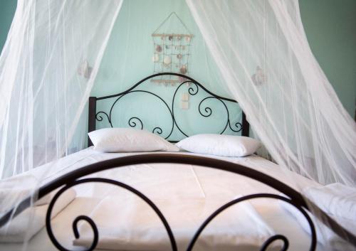 Postel nebo postele na pokoji v ubytování Studios Petra