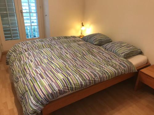 a bed with two pillows on it in a bedroom at Bad Ragaz Appartement in Bad Ragaz
