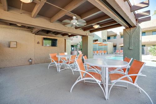a patio with tables and chairs and a pool at 3 Palms Hotel in Scottsdale
