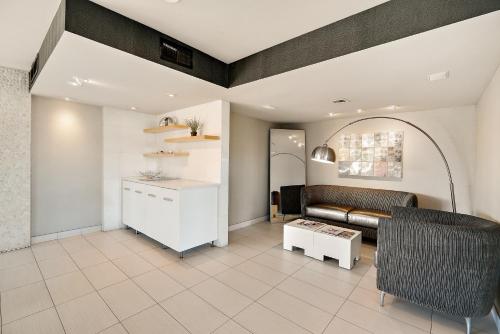 a living room with a couch and a table at Scottsdale Parkview in Scottsdale