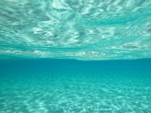 a close up of the water in the ocean at Estia in Plátanos
