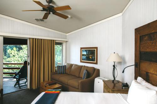 a hotel room with a bed and a couch at Sunnyside Resort and Lodge in Tahoe City