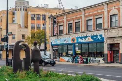a city street with a parking meter in front of a building at Calm & Well-Equipped 2BR Chicago Apartment - Central Cozy in Dunning
