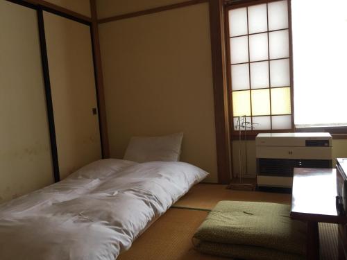 Krevet ili kreveti u jedinici u okviru objekta Maison de Sasagawa
