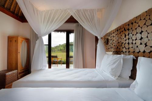 Giường trong phòng chung tại Villa Arcadia