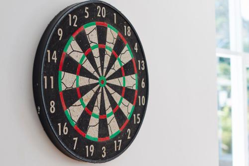 a dart board hanging on a wall at Galway Heights Hotel in Nuwara Eliya