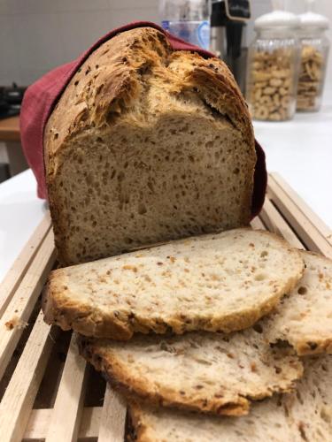 a loaf of bread sitting on a tray with two slices at Boutique Hotel Palazzo Corso Umberto in Boiano