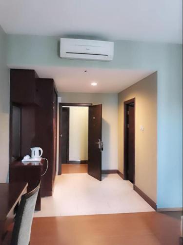 an empty room with a hallway with a ceiling at Ginasuite Hotel in Bandar Seri Begawan