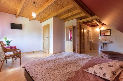 a bedroom with a large bed in a room at Villa Bezycer in Gowidlino