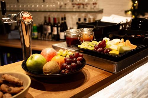 a bunch of fruits and vegetables on a counter at Hotel Vanha Rauma in Rauma