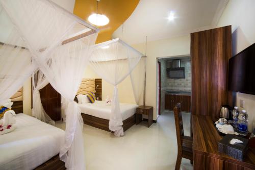 Ένα ή περισσότερα κρεβάτια σε δωμάτιο στο Antonio Garden Hotel