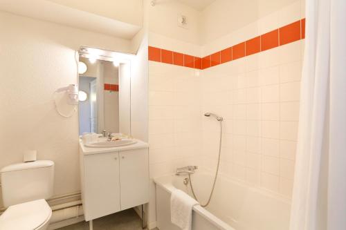Ett badrum på Vacancéole - Les Demeures Champenoises