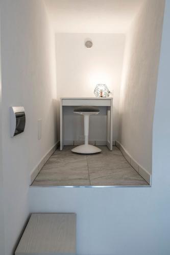 a room with a table and a stool at Rocca Palazzaccio in Impruneta