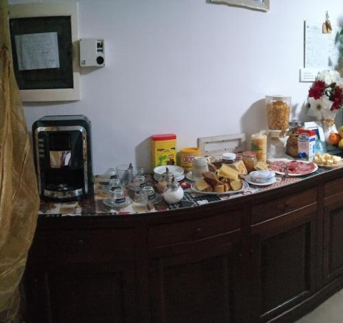 a counter top with food on top of it at Adria Bella Locazione Turistica in Adria