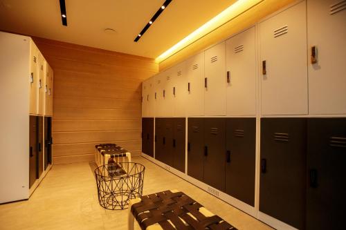 a locker room with lockers and a basket in it at Jurmala Golf Club&Hotel in Piņķi