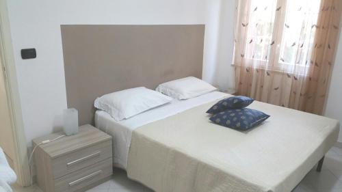 A bed or beds in a room at Villa Benedetta
