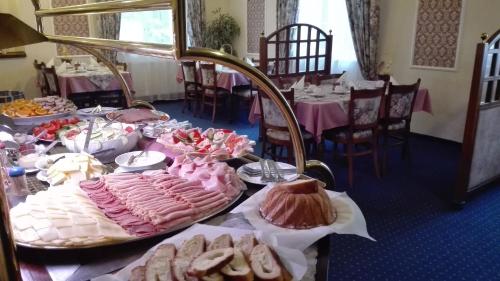 a table topped with lots of different types of food at Eurohotel in Karlovy Vary