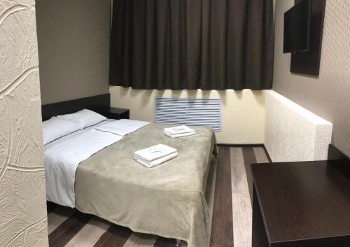 Кровать или кровати в номере Murmansk Discovery - Hotel Kompas