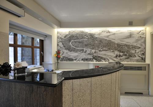 a large drawing on the wall in a room with a desk at Al Theatro Palace in Venice