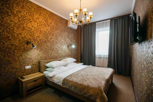 Katil atau katil-katil dalam bilik di Luna Hotel