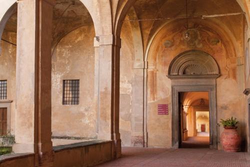 an entrance to a building with an archway at Certosa di Pontignano Residenza d'Epoca - Place of Charme in Ponte A Bozzone